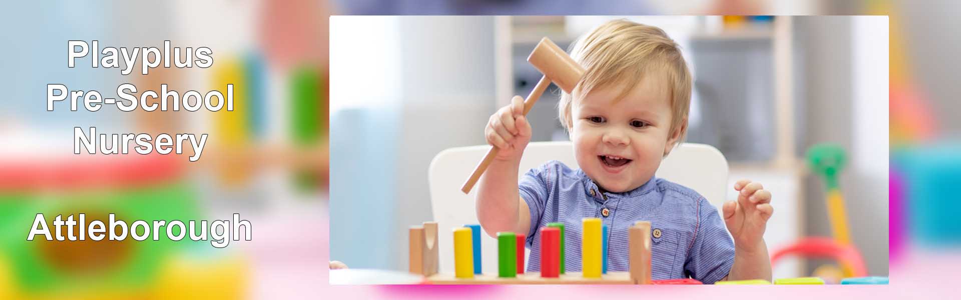 Playplus Nursery Attleborough - toddler playing with peg hammer